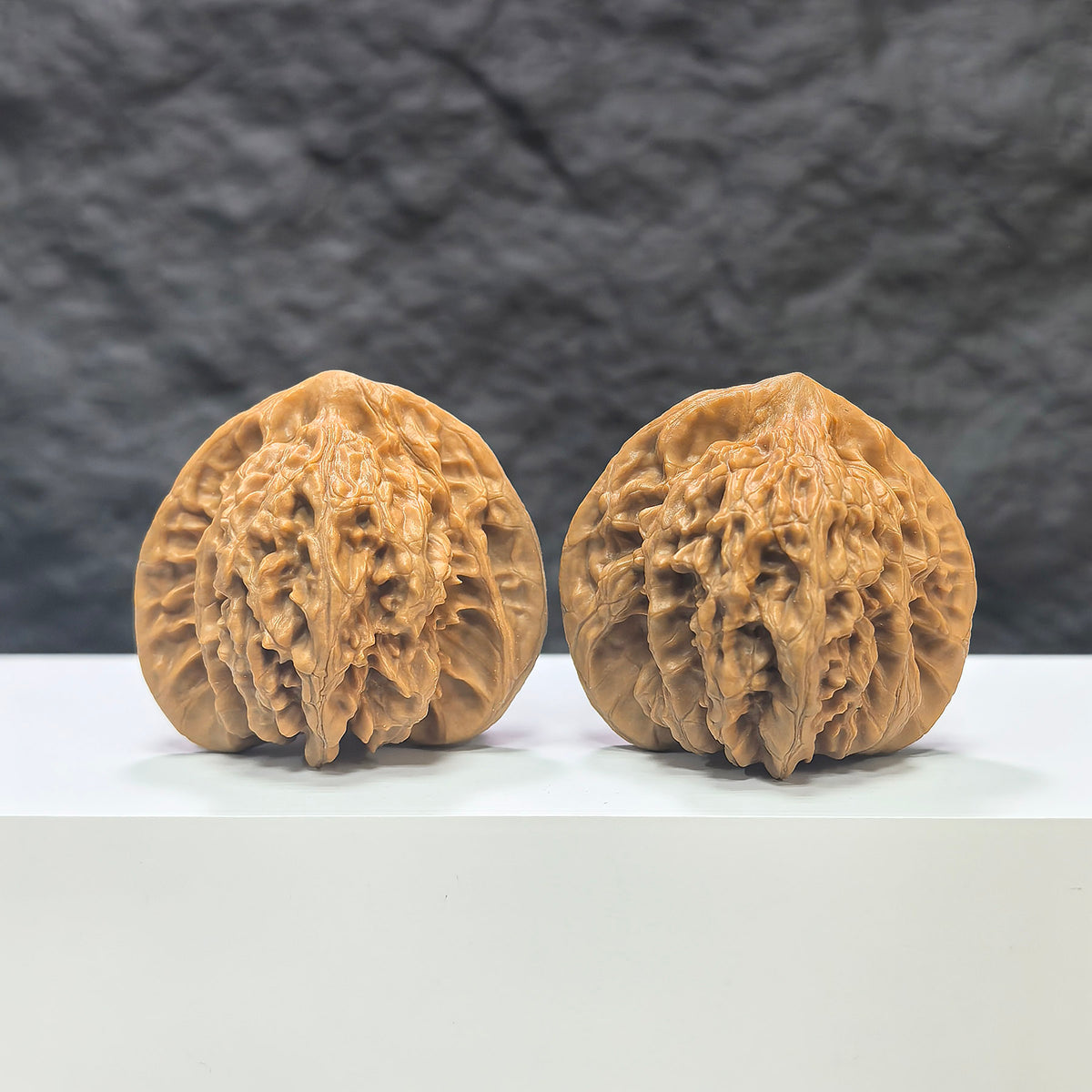 Pair of Peach Heart Concave Base Wenwan Walnuts from Wenwan Art, featuring deep bases and natural walnut textures.