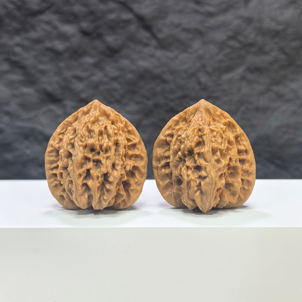 Pair of Peach Heart Xiayunling Wenwan walnuts from Wenwan Art, 38mm size, showcasing smooth, polished walnut carvings with unique patterns.