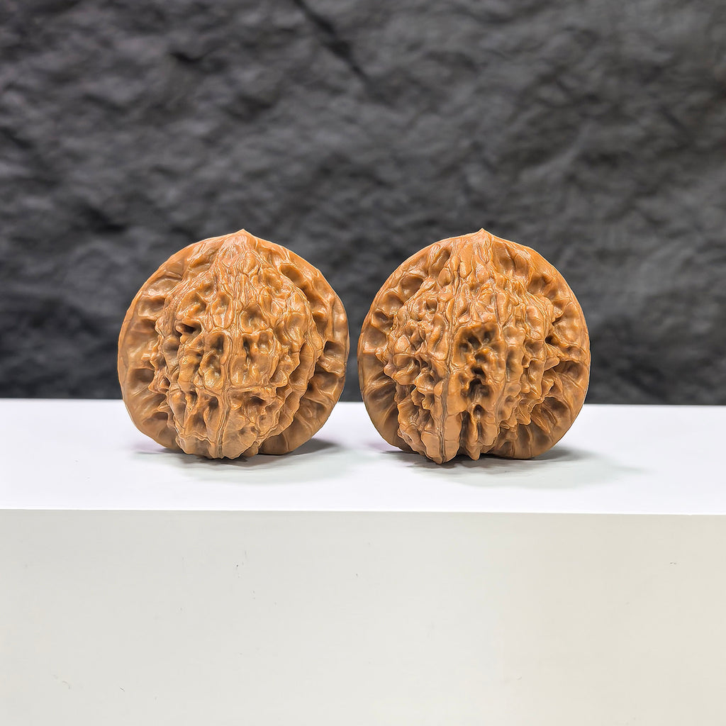 Pair of Golden Kylin Wenwan walnuts by Wenwan Art, 37mm x 36mm, showcasing the detailed carved golden kylin design.