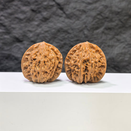 Pair of Golden Kylin Wenwan walnuts by Wenwan Art, 37mm x 36mm, showcasing the detailed carved golden kylin design.
