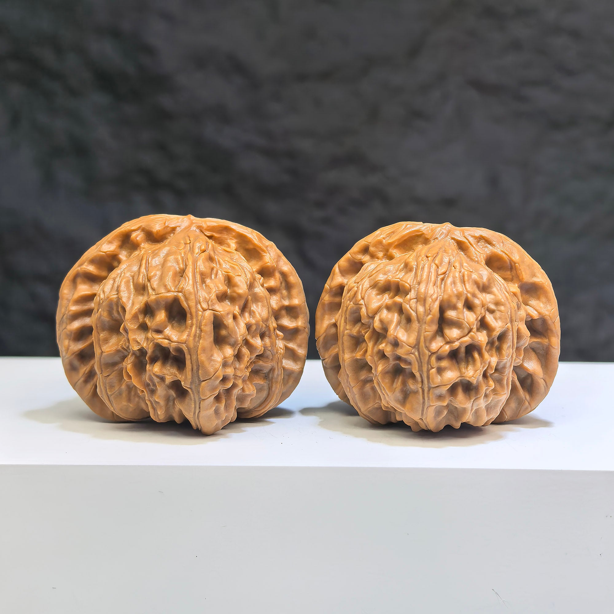 Pair of White Lion Wenwan Walnuts by Wenwan Art, 41mm each, featuring detailed carvings of white lions on smooth walnut surfaces.