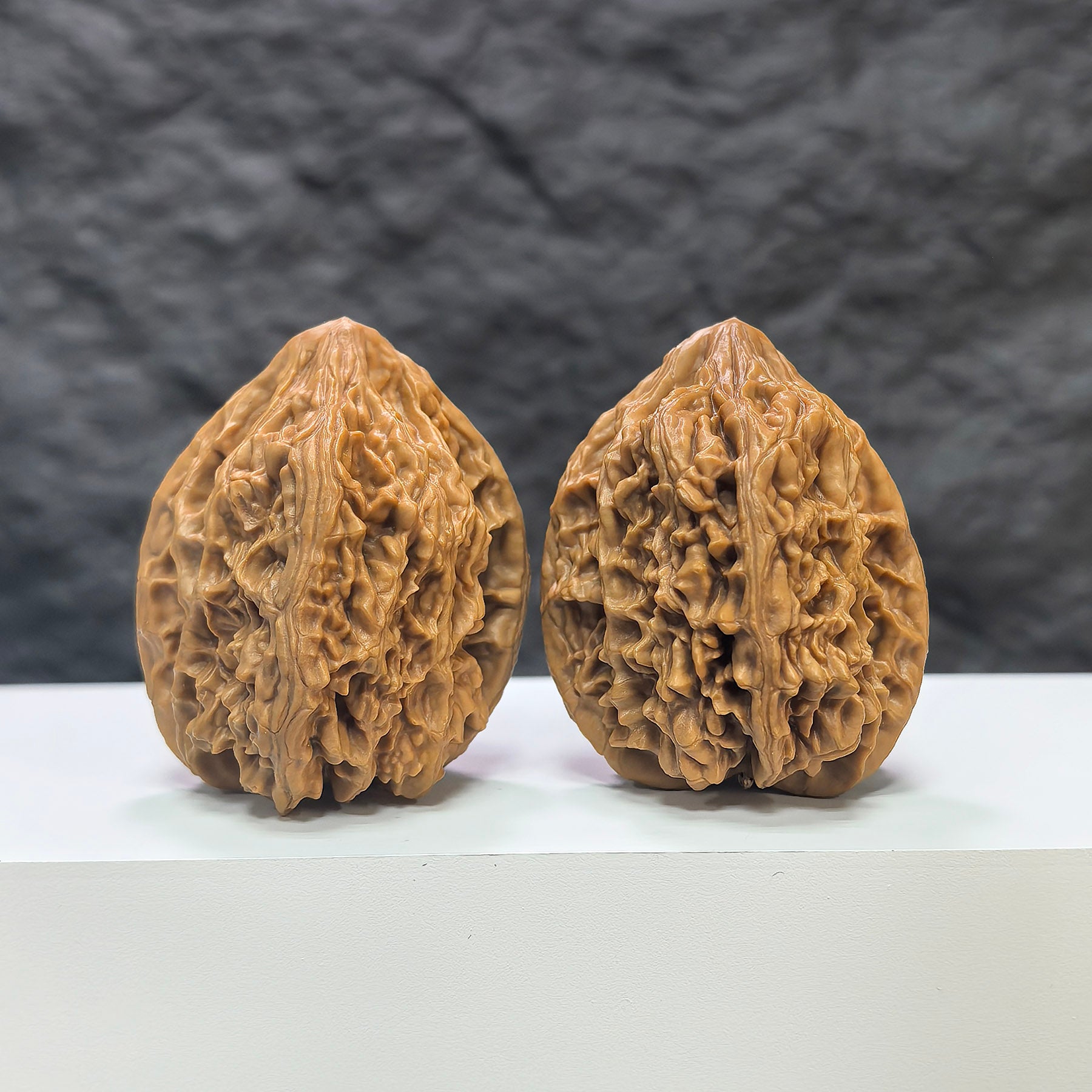 Pair of Beijing Chicken Heart Wenwan walnuts from Wenwan Art, 41mm each, showcasing smooth, rounded walnut surfaces with natural coloration.
