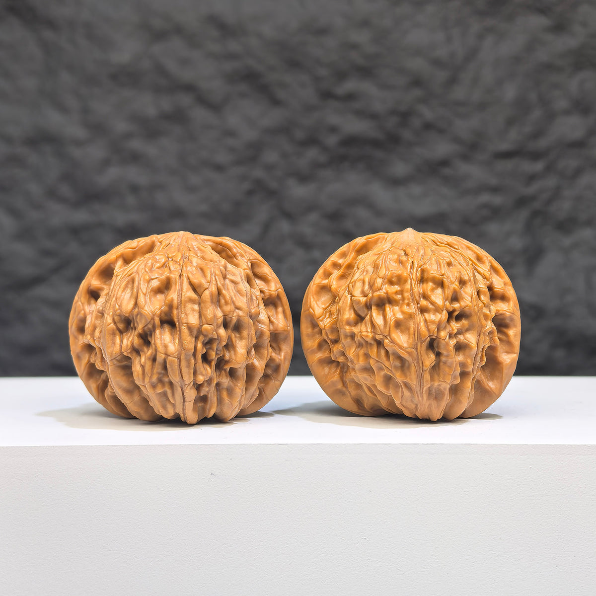 Pair of Wenwan Art Pocket Symmetrical Millstone miniature Wenwan walnuts, 36mm x 33mm, showcasing detailed craftsmanship.