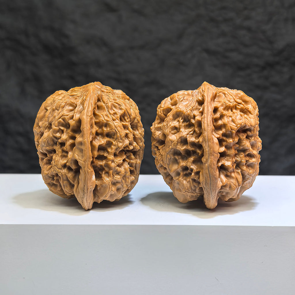 Pair of Classic Scholar Wenwan Walnuts from Wenwan Art, hand-matched with 44mm x 42mm size, featuring detailed carved patterns.