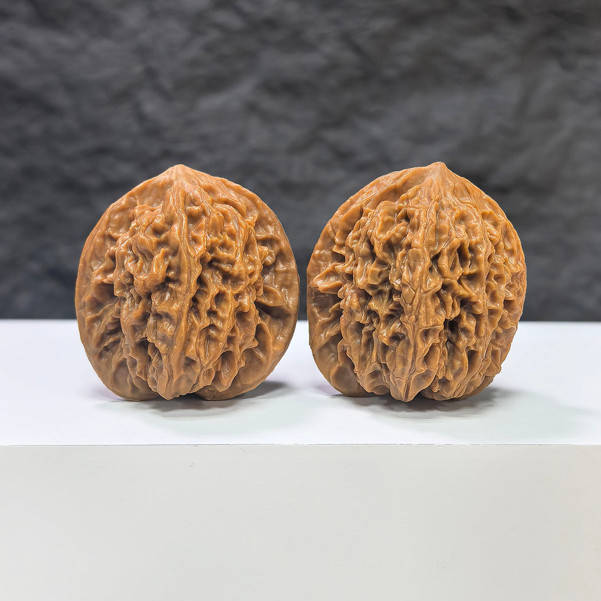 Pair of Panlong Texture Wenwan Walnuts from Wenwan Art, 34mm x 31mm, showcasing detailed traditional carvings and rich wood grain.