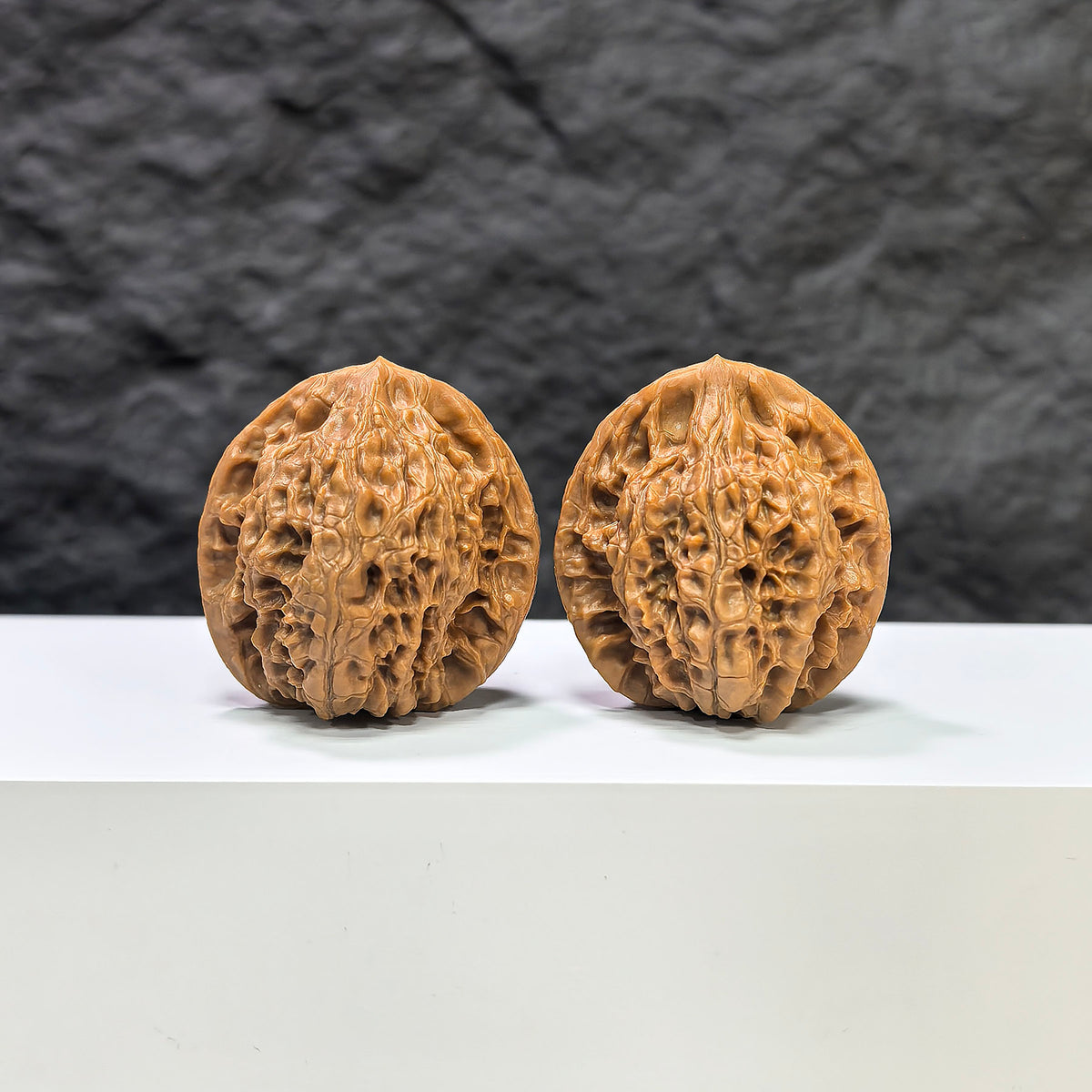 Pair of Golden Kylin Wenwan Walnuts by Wenwan Art, 36mm x 34mm, featuring intricate natural walnut carvings and golden details.