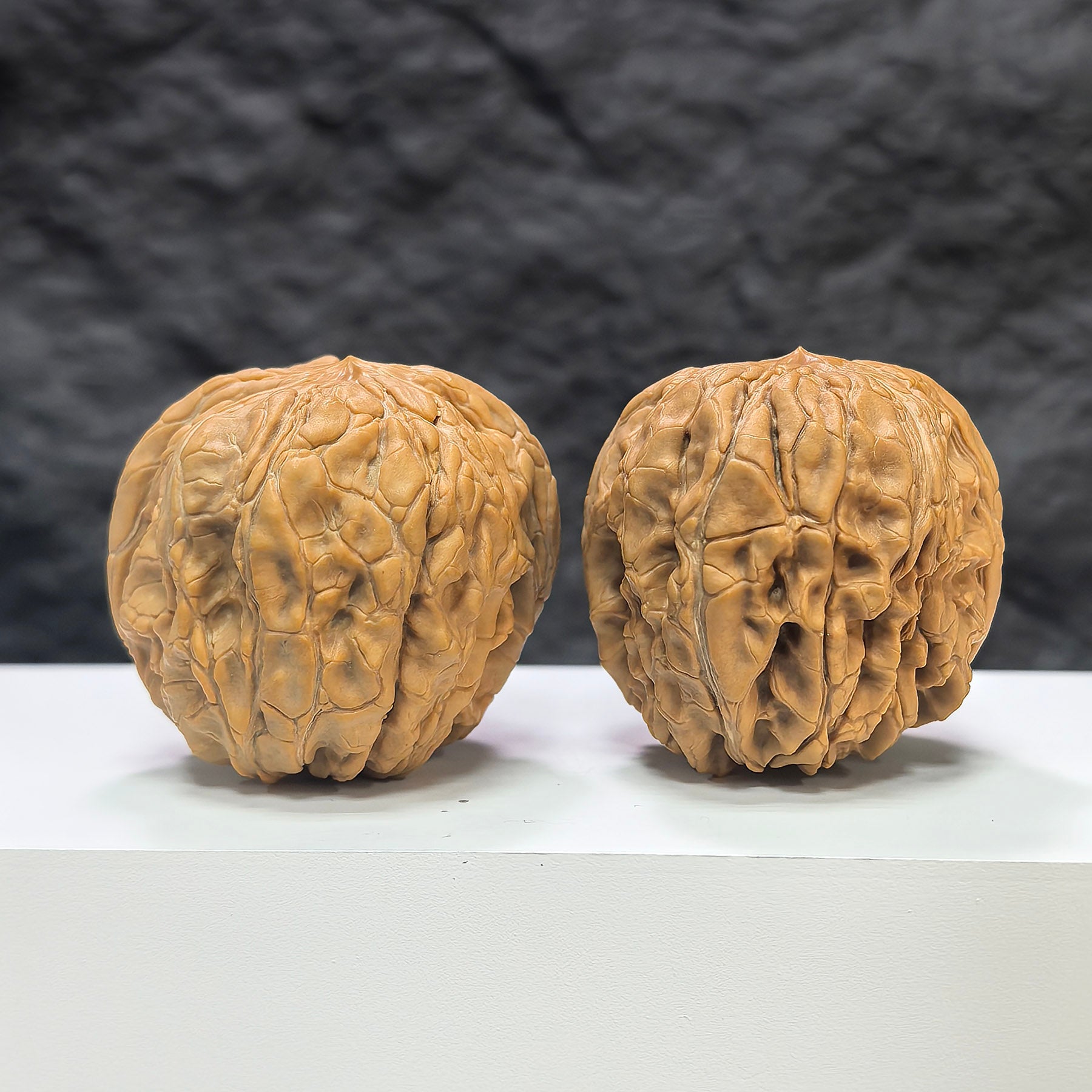 Pair of Classic Scholar Wenwan walnuts from Wenwan Art, hand-matched, 44mm x 46mm, featuring detailed natural walnut textures.