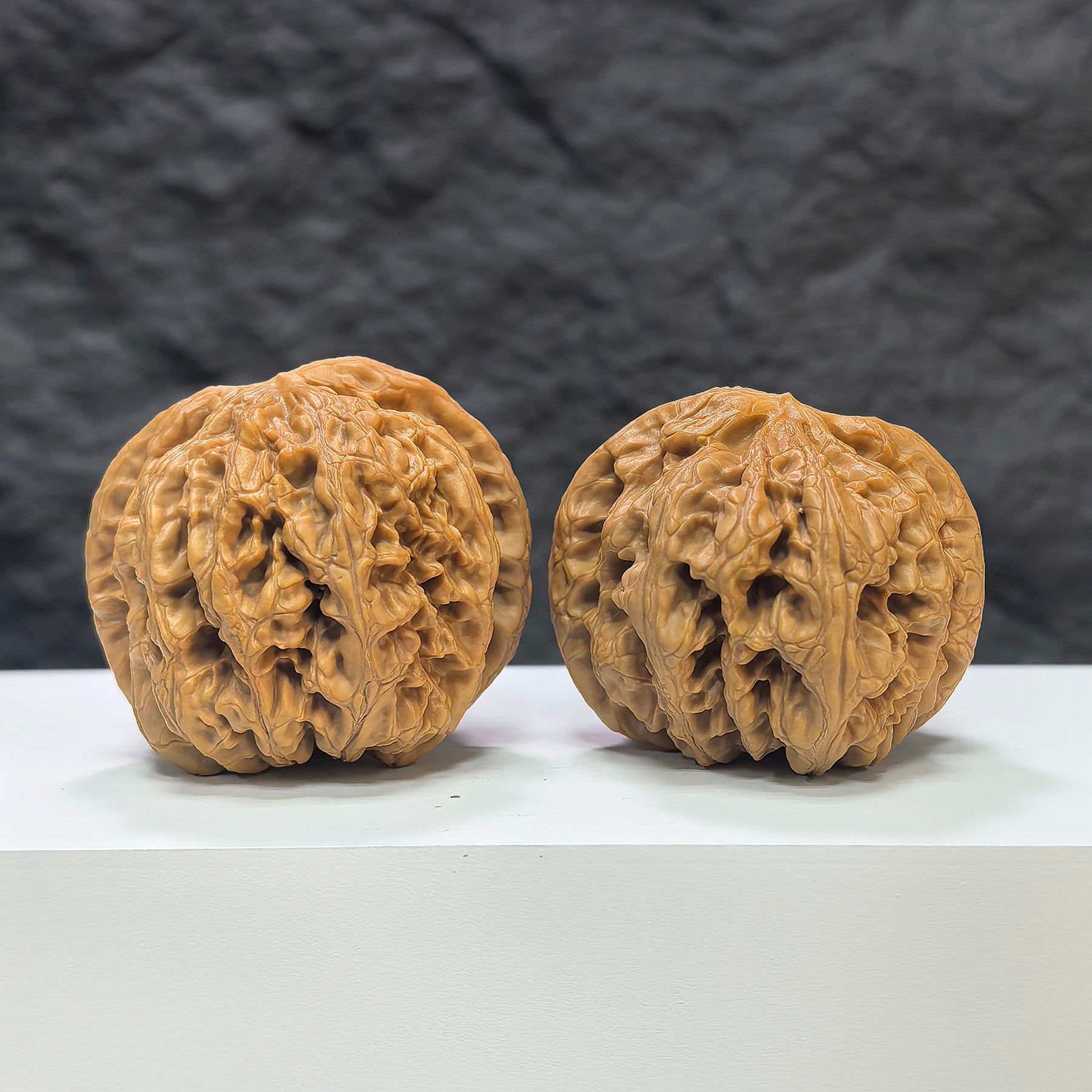 Pair of Classic Scholar Wenwan Walnuts by Wenwan Art, hand-matched with textured surface, 45mm size, featuring fine grain details.
