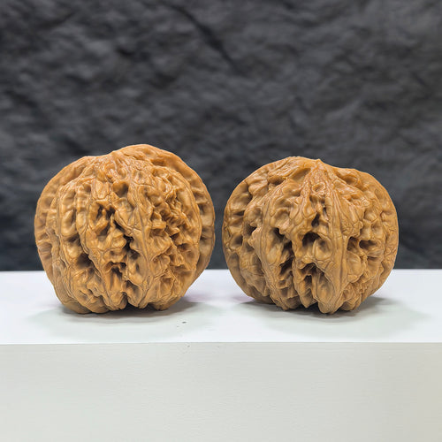 Pair of Classic Scholar Wenwan Walnuts by Wenwan Art, hand-matched with textured surface, 45mm size, featuring fine grain details.