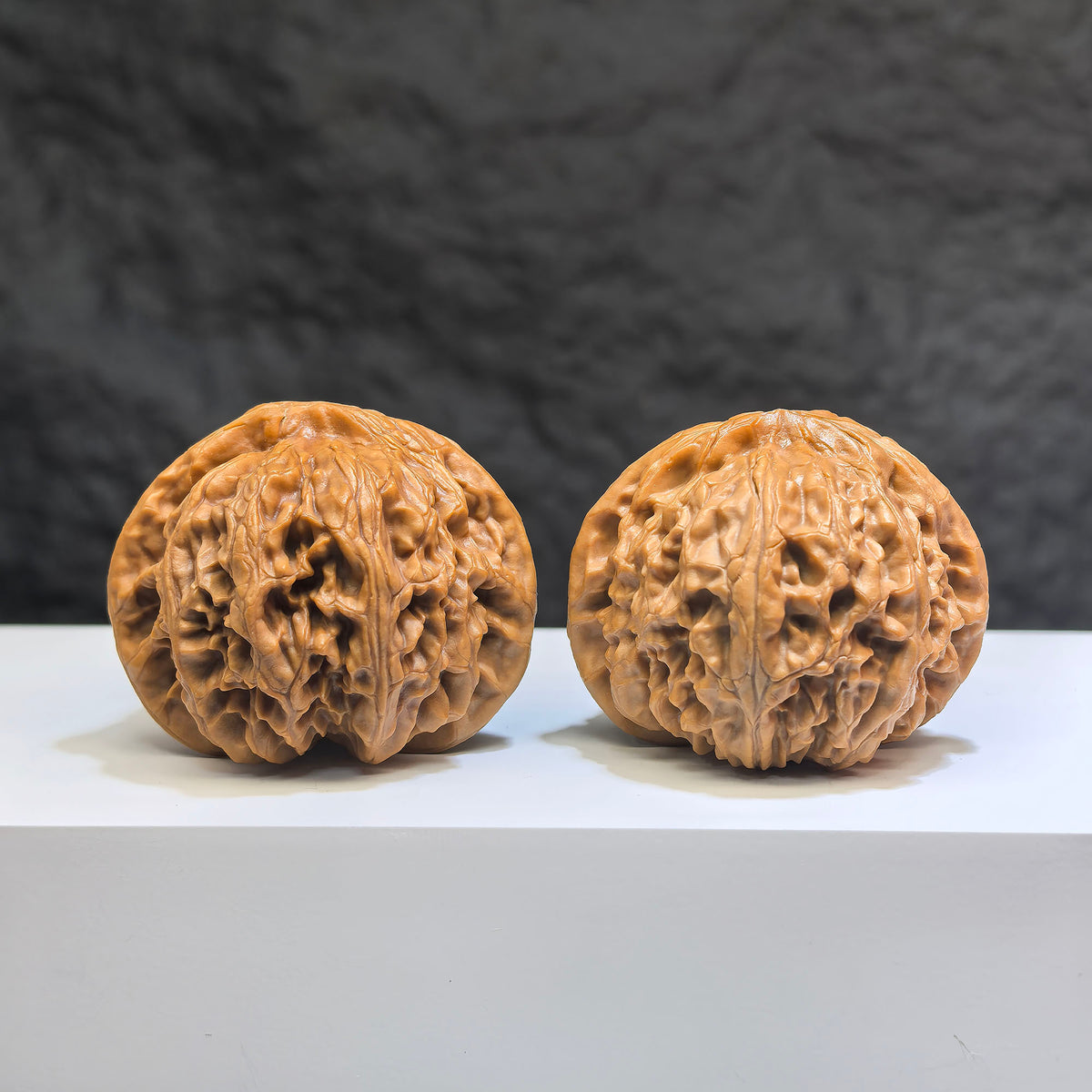 Pair of Classic Scholar Wenwan Walnuts from Wenwan Art, hand-matched spherical 球形宮燈, 41mm x 38mm, detailed natural wood grain.