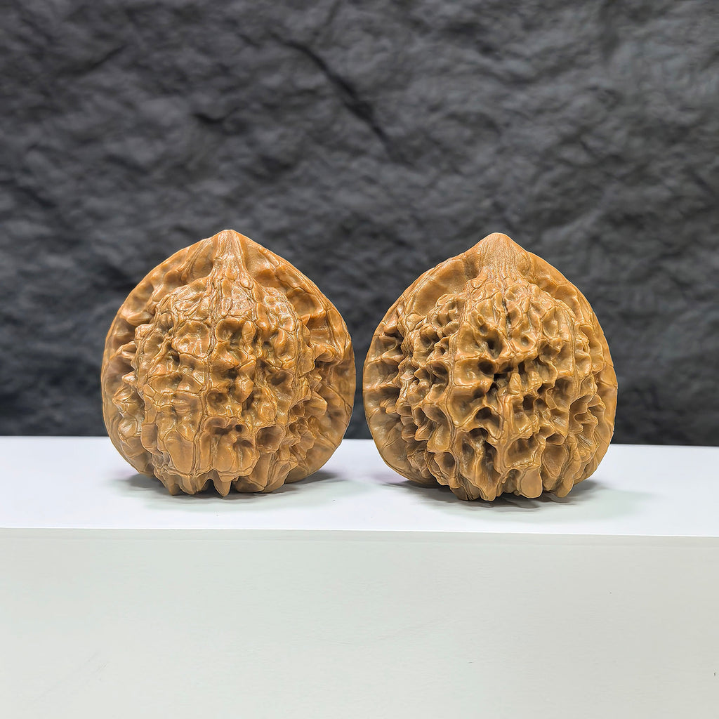Pair of official Wenwan Walnuts from Wenwan Art, classic walnut shape with detailed natural wood grain, 44mm x 42mm size.
