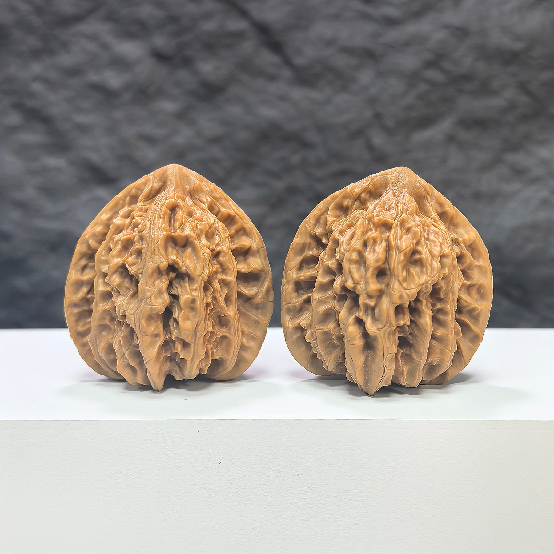 Pair of Xiayunling Peach Heart Concave Base Wenwan walnuts by Wenwan Art, showing smooth, polished deep-base walnut with peach heart shape.