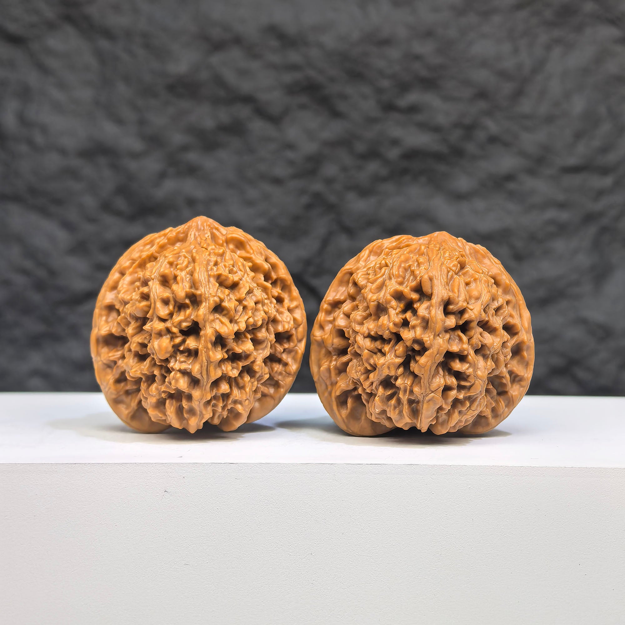 Pair of Babys Breath Wenwan Walnuts with full star patterns, 38mm x 37mm, from Wenwan Art, showcasing intricate carved designs.