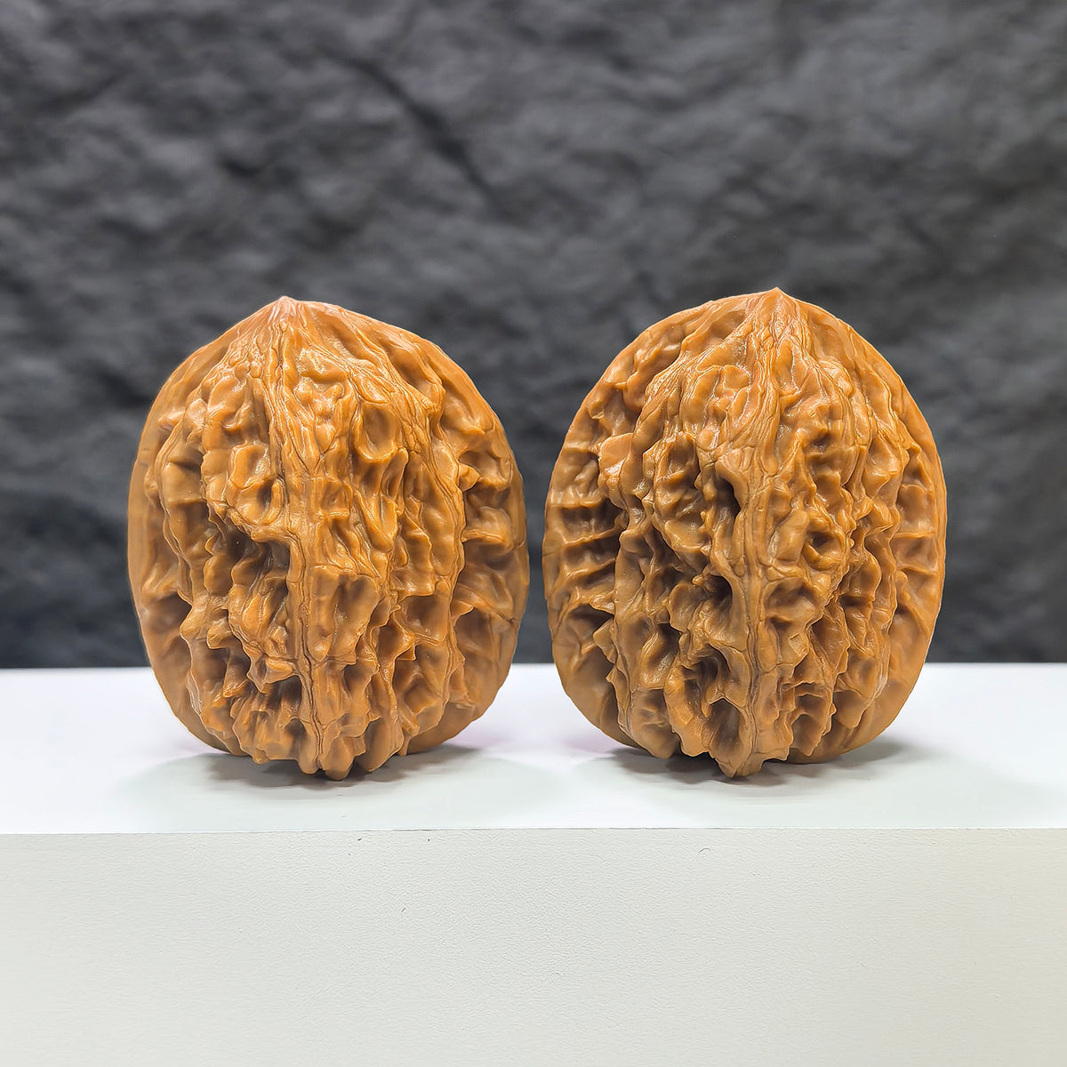 Pair of Beijing Chicken Heart Wenwan walnuts by Wenwan Art, featuring 43mm x 45mm polished walnut with intricate natural grain patterns.