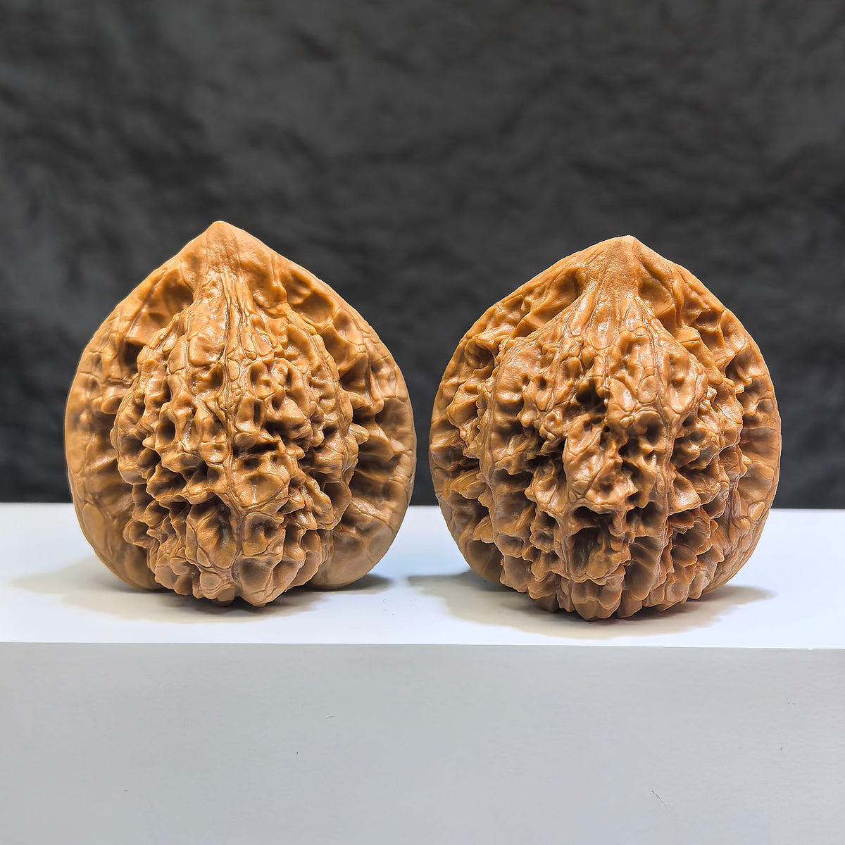 Pair of Classic Scholar Wenwan Walnuts by Wenwan Art, hand-matched with 桃心凹底麒麟紋, 47mm x 43mm, detailed natural wood grain