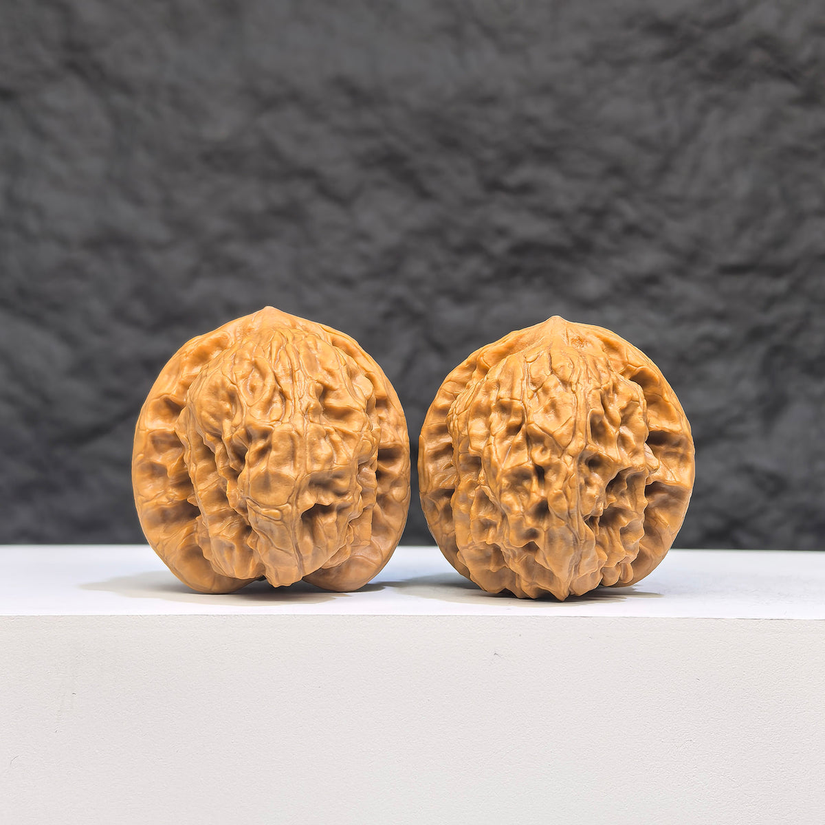 Pair of Wild Wolf Wenwan Walnuts by Wenwan Art, authentic wild walnuts with 35mm x 37mm size, featuring natural wood grain.