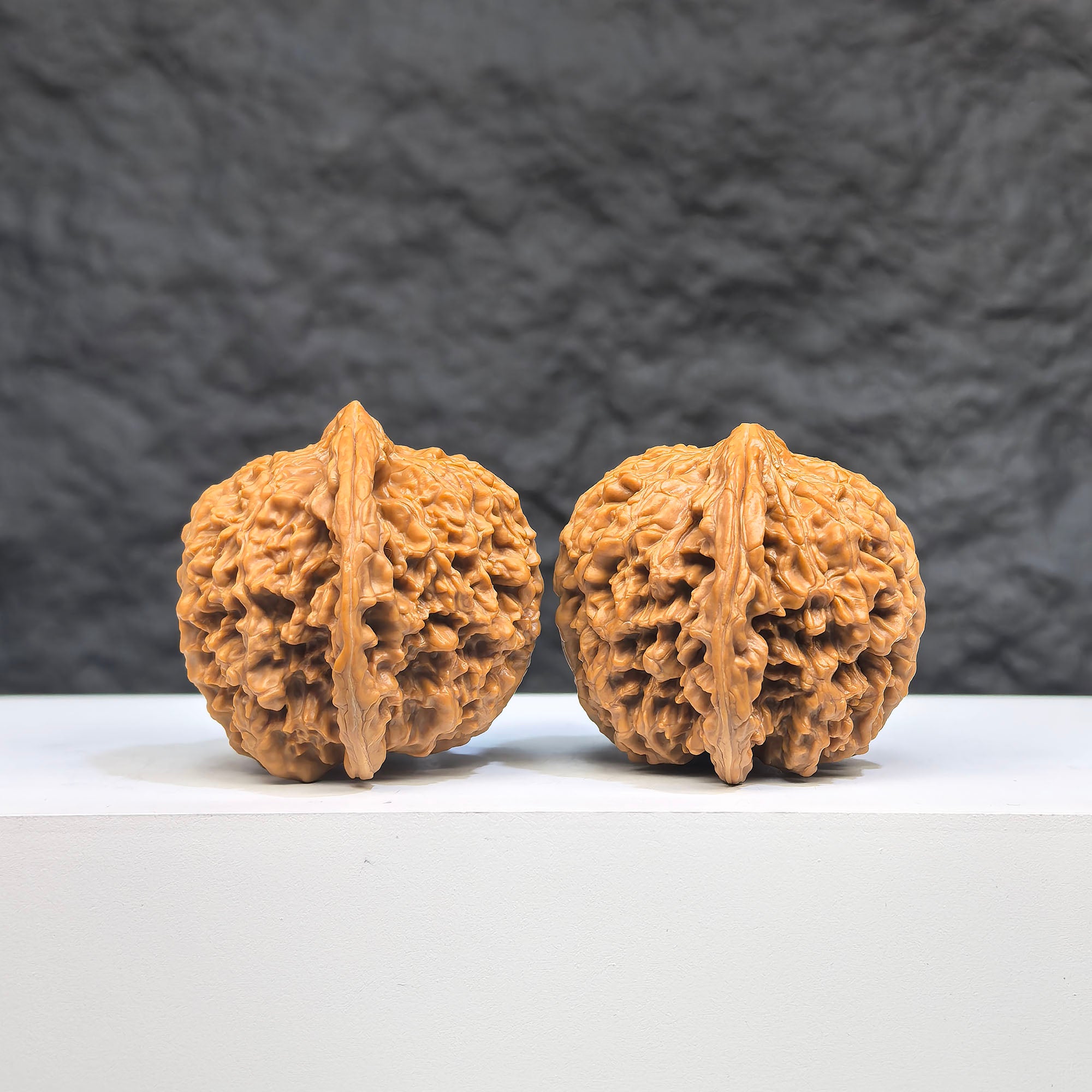 Pair of Wenwan Art Babys Breath Full Stars Wenwan walnuts with intricate star patterns, measuring 38mm by 37mm, natural wood finish.
