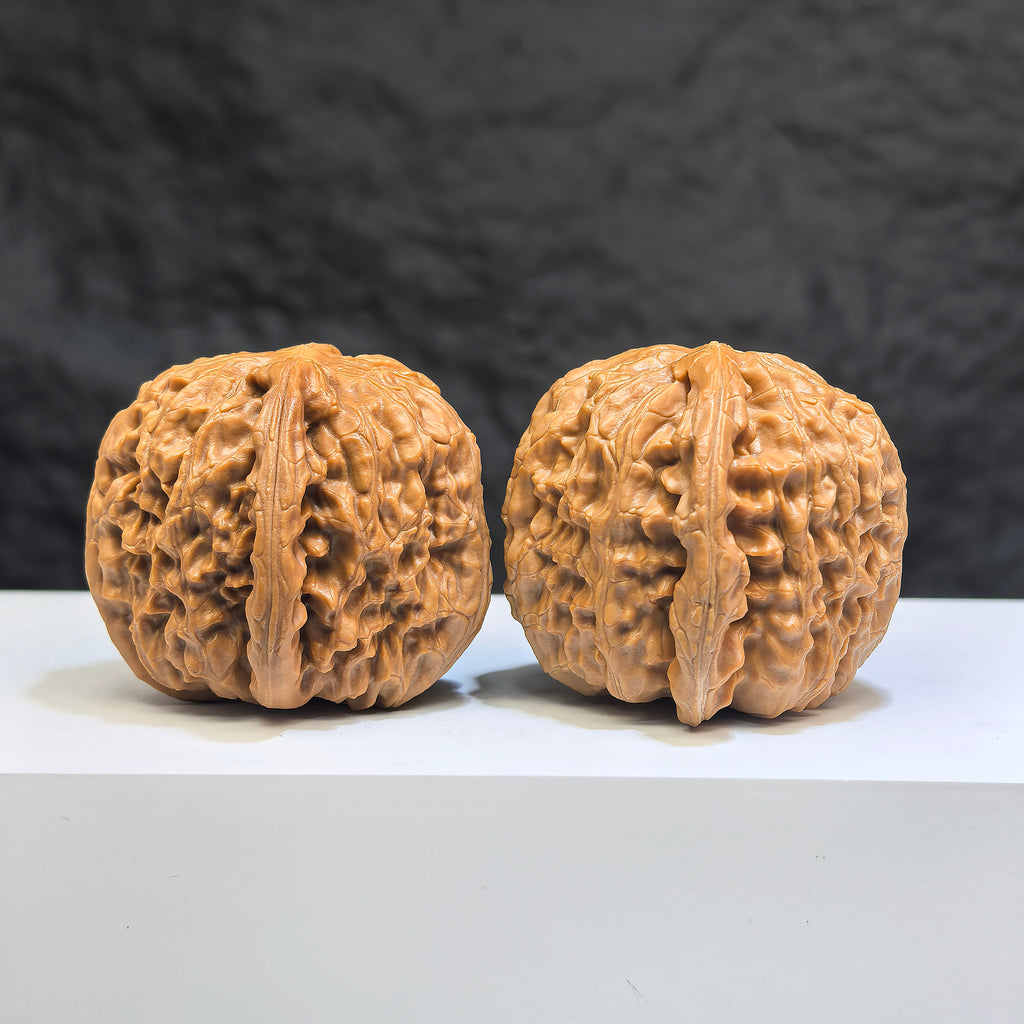 White Lion Wenwan Walnuts pair by Wenwan Art, 38mm x 39mm, featuring detailed carved white lion designs on smooth walnuts.