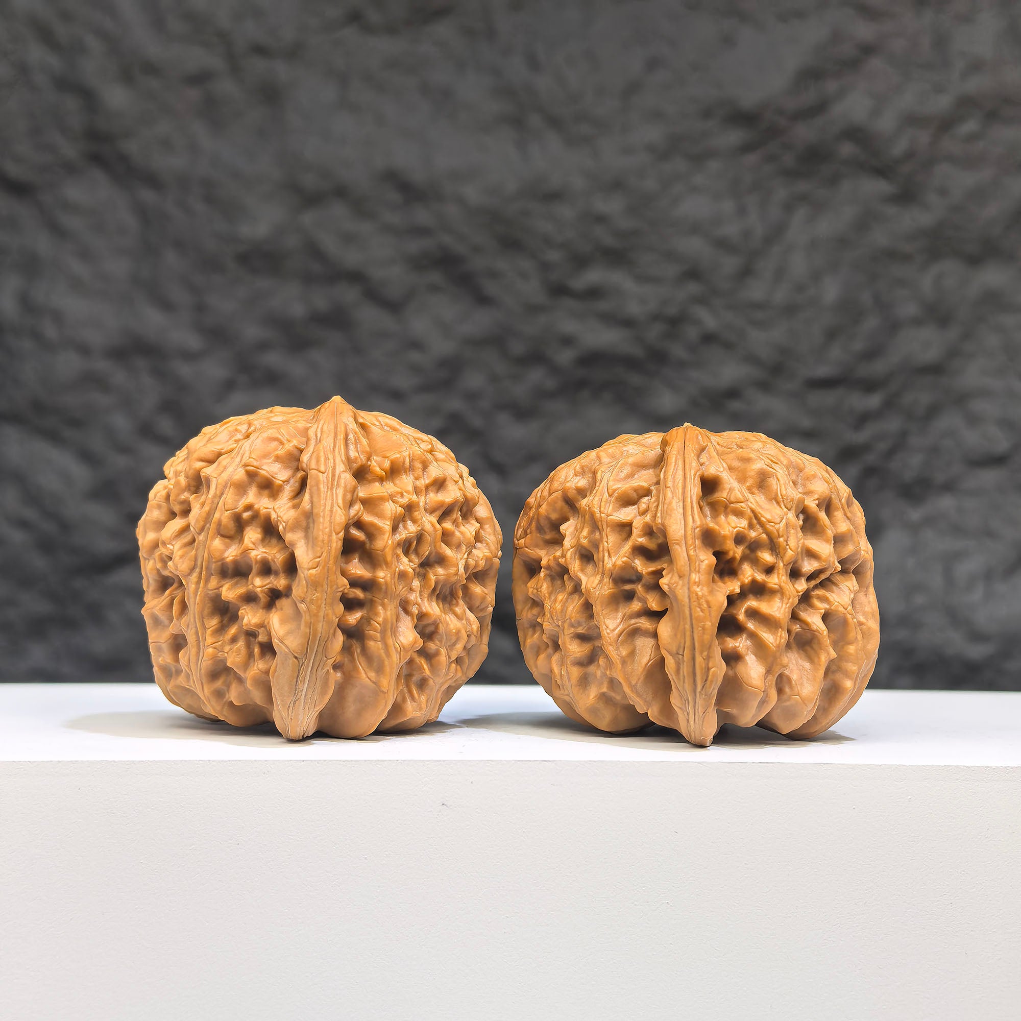 Pair of spherical white lion Wenwan walnuts from Wenwan Art, round profile, 41mm x 40mm, featuring detailed white lion carvings.