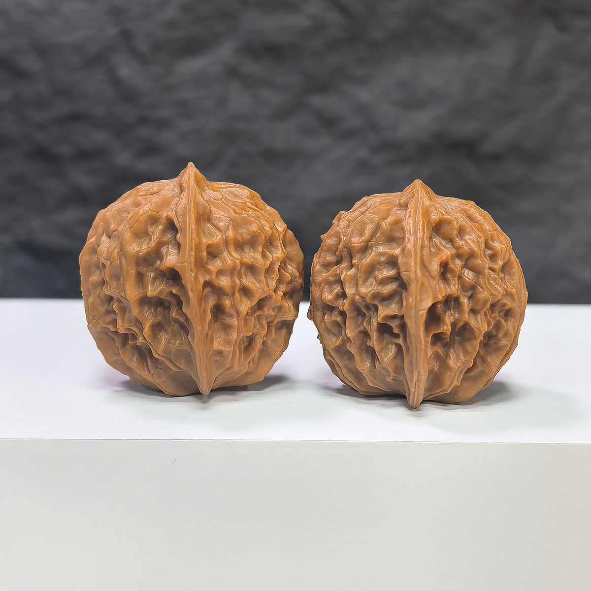 Miniature Wenwan Walnut Pair, Pocket Phoenix Tail design by Wenwan Art, 30mm x 31mm, detailed natural walnut carvings.