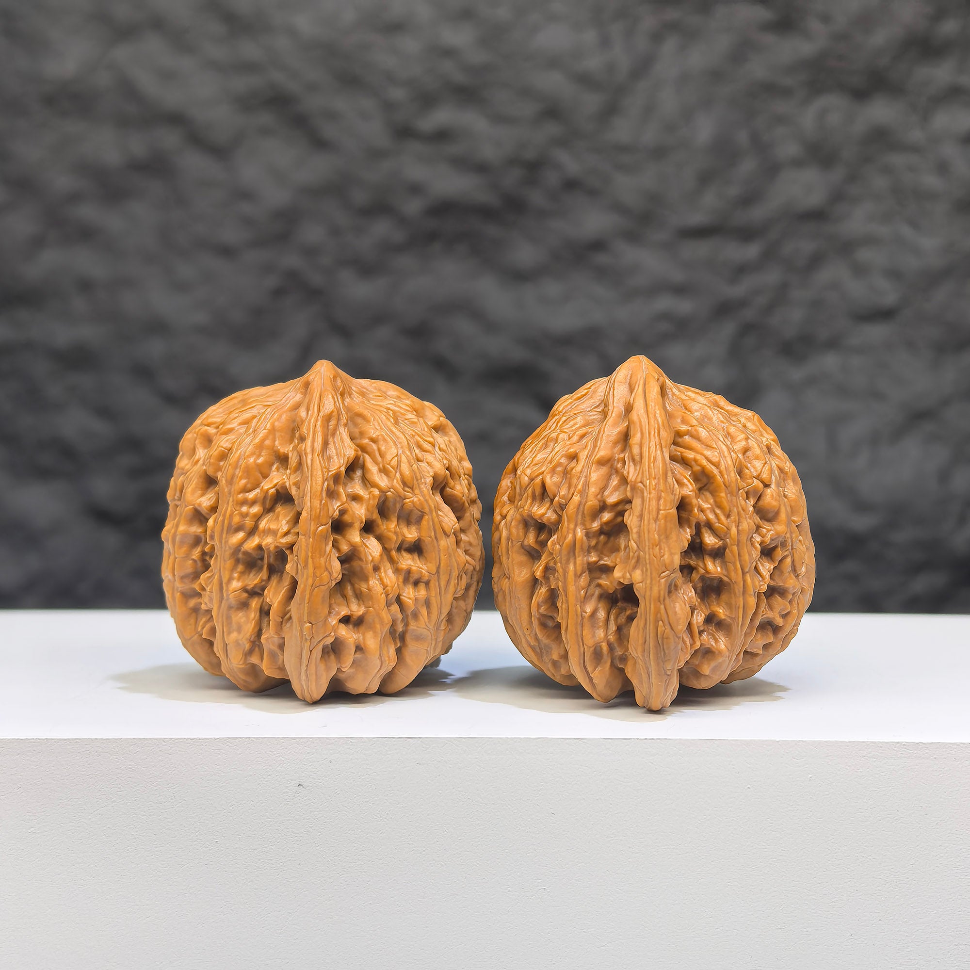 Pair of Yuhua Stone Wenwan walnuts from Wenwan Art, 36mm x 35mm, showcasing natural patterns and smooth polished surfaces.