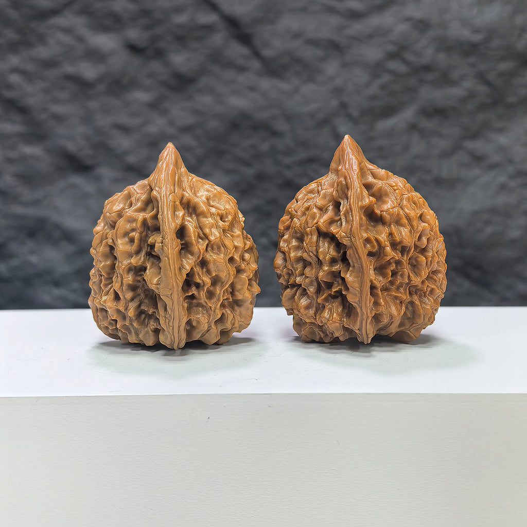 Pair of Wenwan Art Official Hat Wenwan walnuts, 40mm x 38mm, featuring intricate carvings on smooth walnut surfaces.