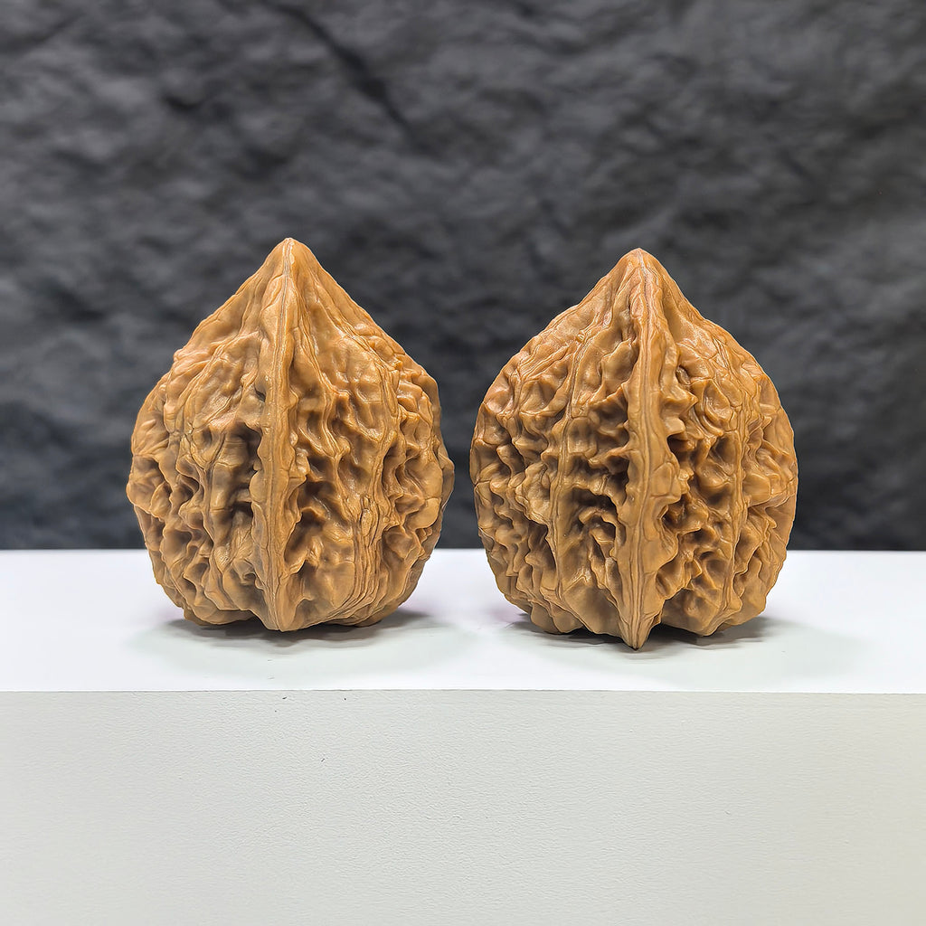 Pair of Beijing Chicken Heart Wenwan walnuts by Wenwan Art, showing 41mm x 40mm walnuts with rich, natural wood grain.