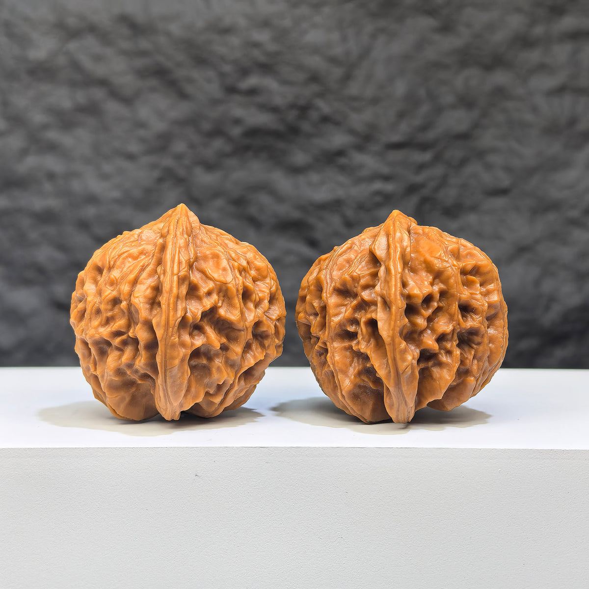 Pair of Wenwan Art Dragon Scale Classic Wenwan Walnuts, 36mm, featuring textured dragon scale patterns on smooth walnut surfaces.