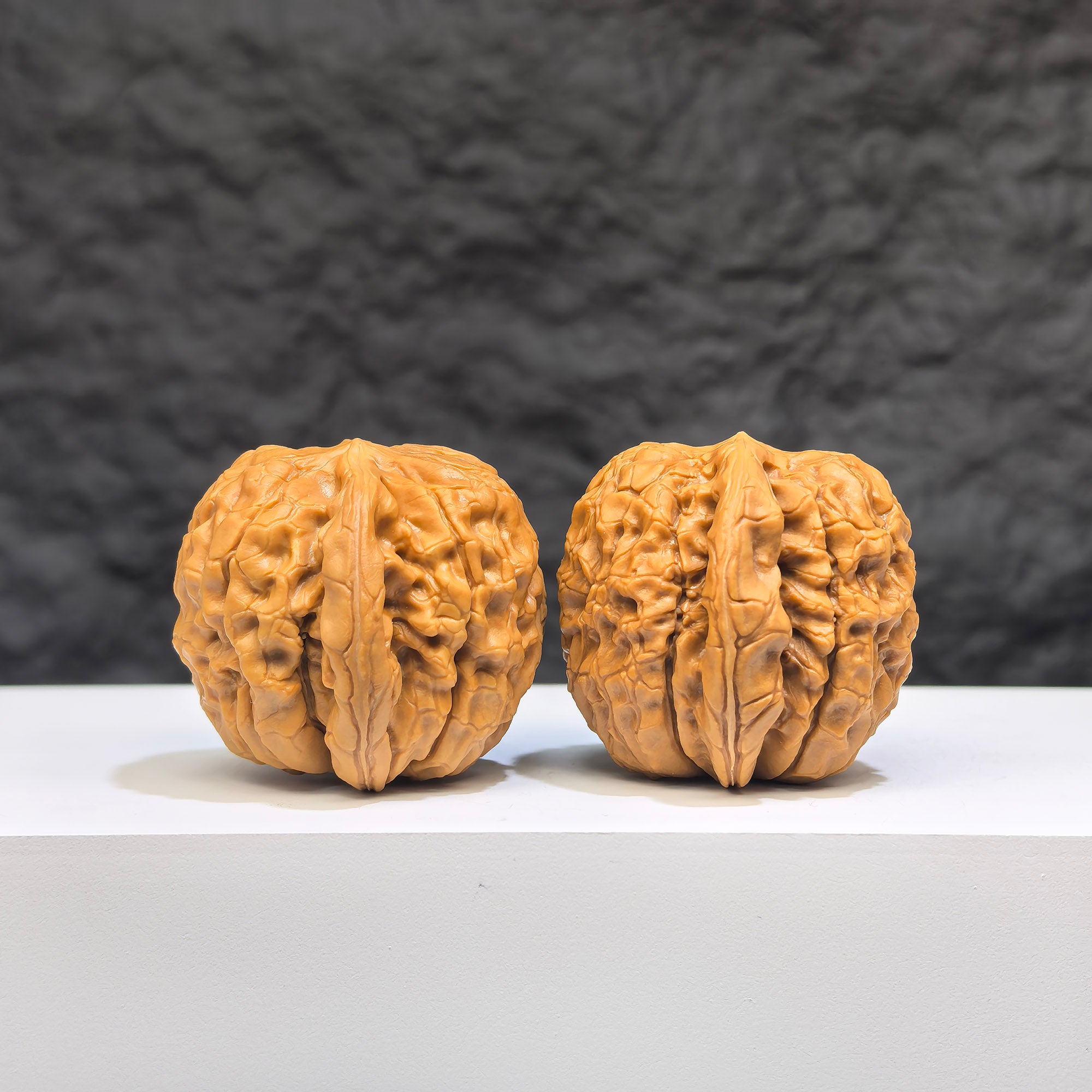 Miniature Wenwan walnut pair with oracle bone script carvings, measuring 33mm x 31mm, crafted by Wenwan Art.