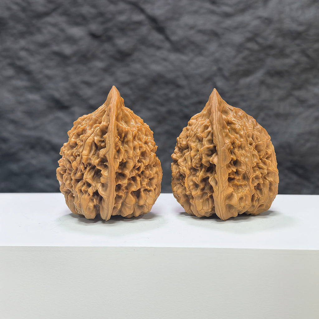 Pair of authentic Wild Wenwan Walnuts from Wenwan Art, 39mm x 38mm, featuring natural wood grain and detailed craftsmanship.