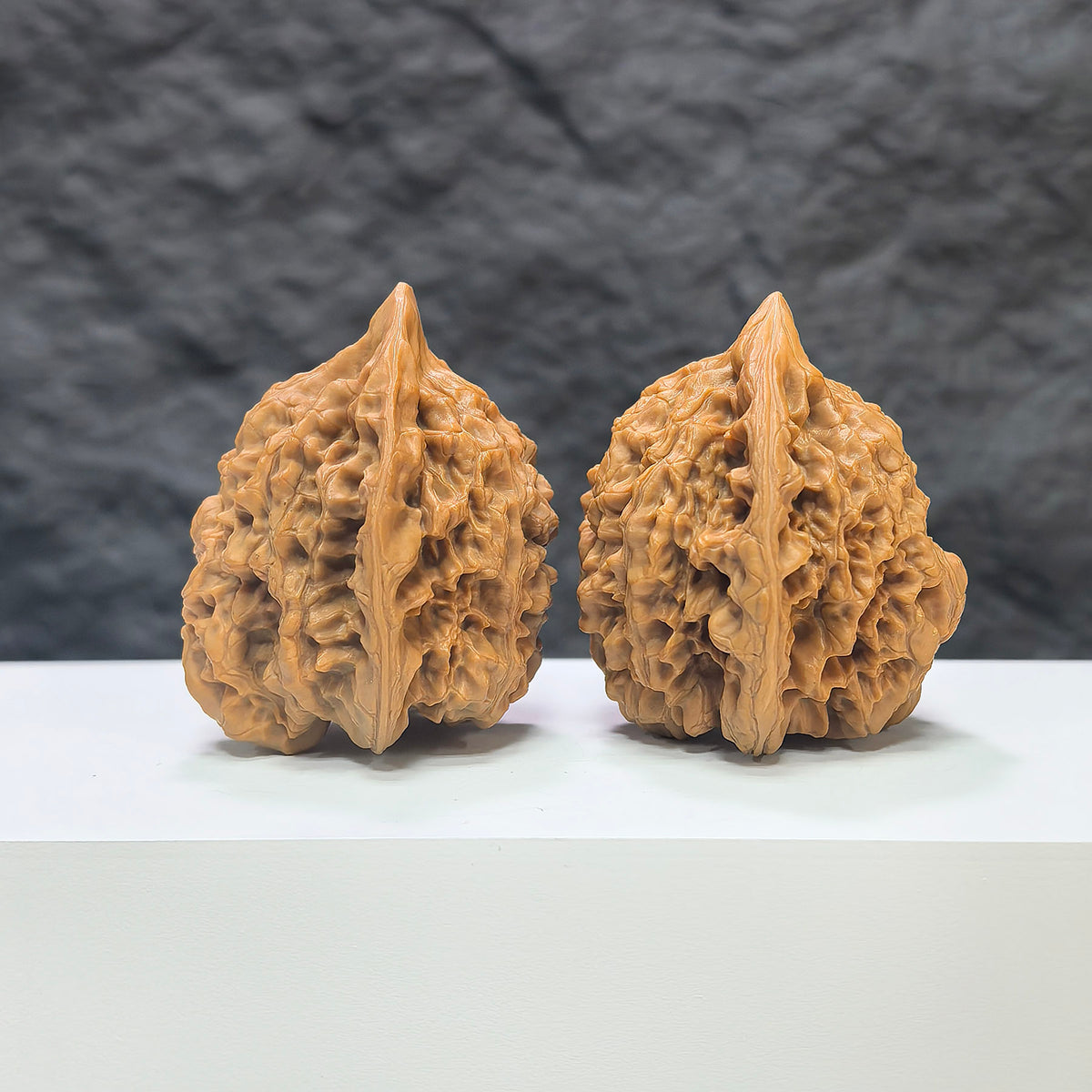 Official Wenwan Art Hat-shaped Walnut pair, 44mm x 40mm, showcasing detailed carvings and natural walnut texture.