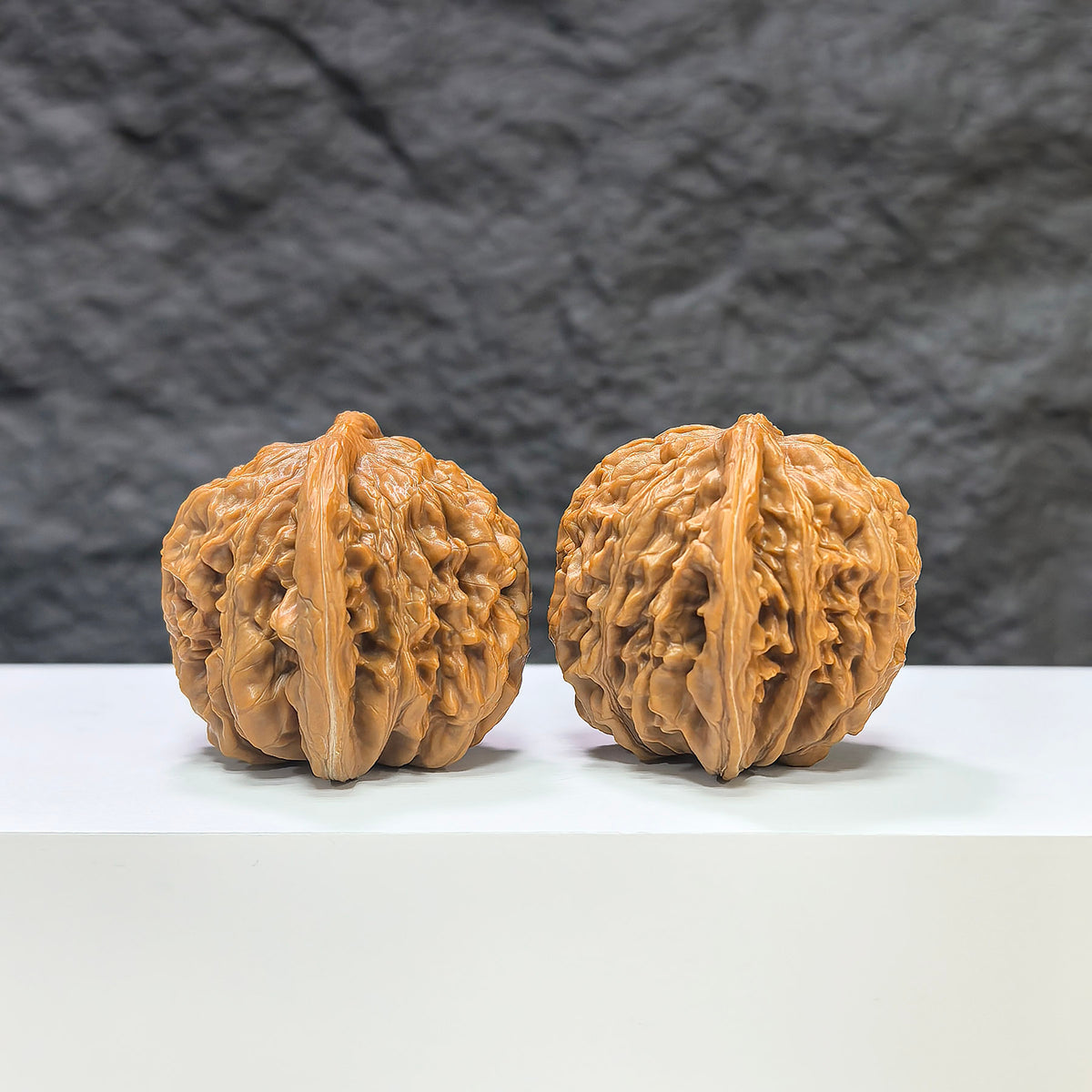 Wenwan Art Sizuolou Classic Wenwan Walnut pair, 42mm x 38mm, showing detailed carved walnut sculptures.