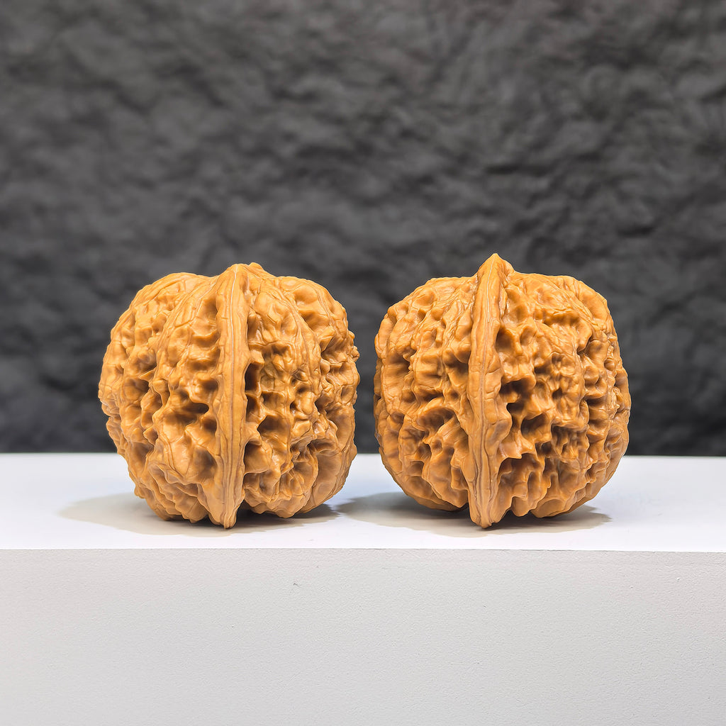 Yuhua Stone Wenwan Walnut pair from Wenwan Art, classic 37mm x 34mm walnuts with natural stone texture and intricate carvings.