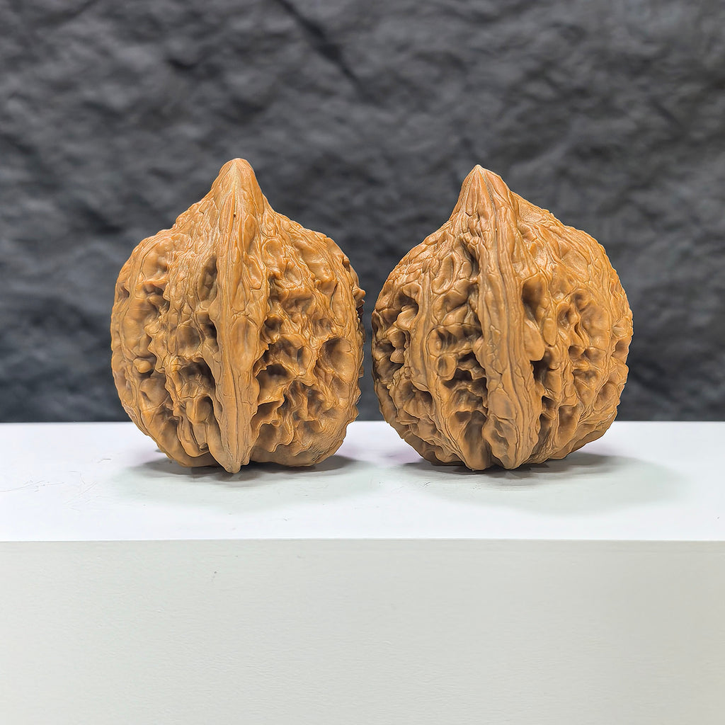 Pair of Dazhan Stone Wenwan Walnuts by Wenwan Art, 41mm x 42mm, featuring polished, natural stone textures and detailed craftsmanship.