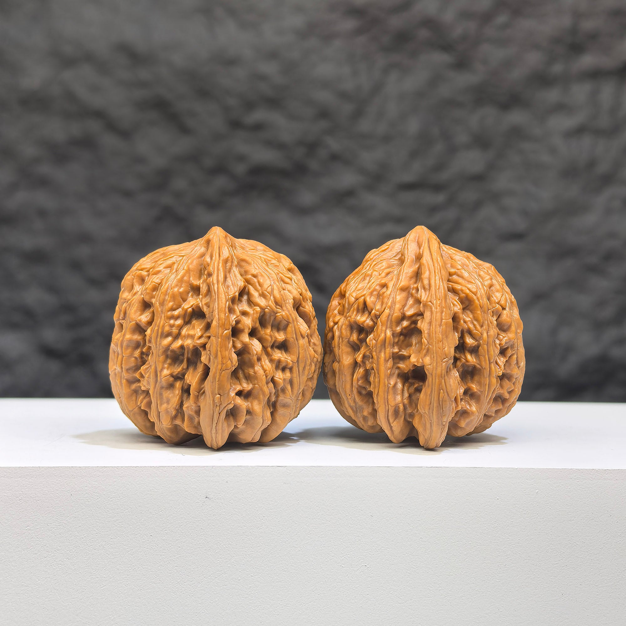 Pair of Peach Heart Concave Base Ruby Wenwan walnuts from Wenwan Art, featuring deep-base design and vibrant red gemstone accents.