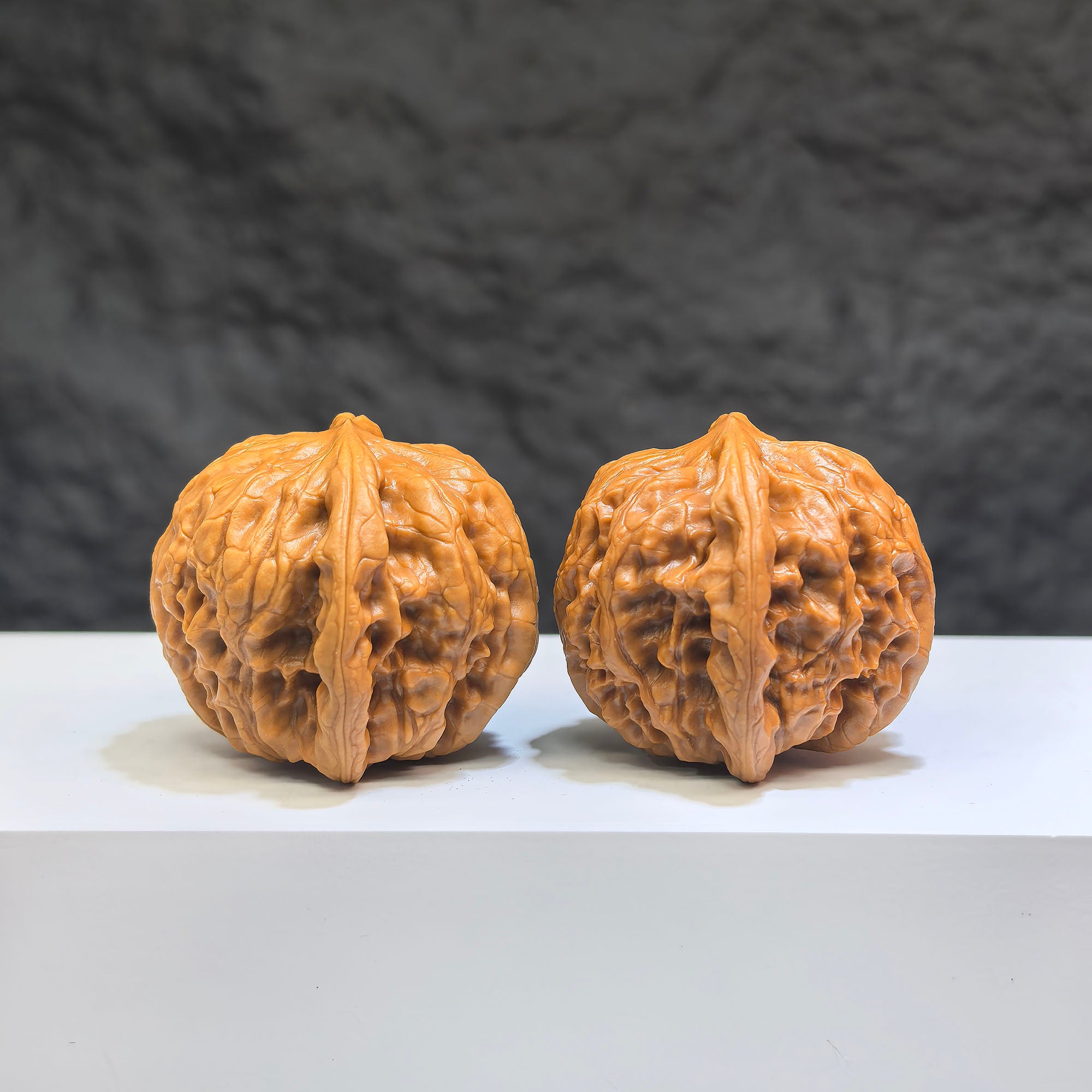 Pair of Wild Wolf Yelang Deep-Carved Wenwan Walnuts from Wenwan Art, featuring intricate carvings and natural walnut appearance.