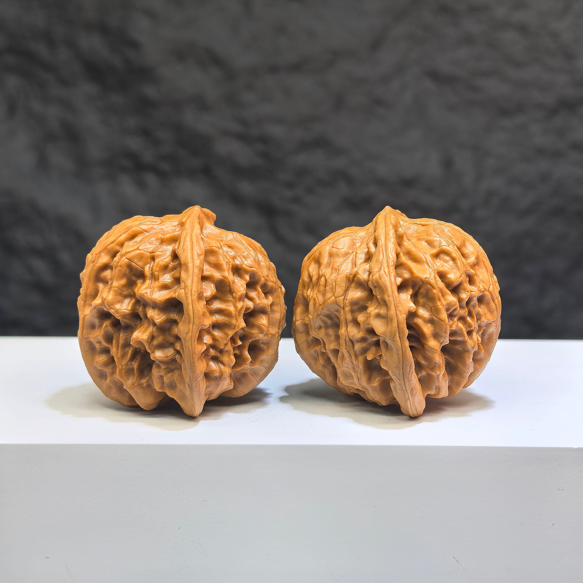 Pair of Wild Wolf Yelang Deep-Carved Wenwan Walnuts by Wenwan Art, 39mm x 37mm, featuring intricate carvings on walnut surfaces.