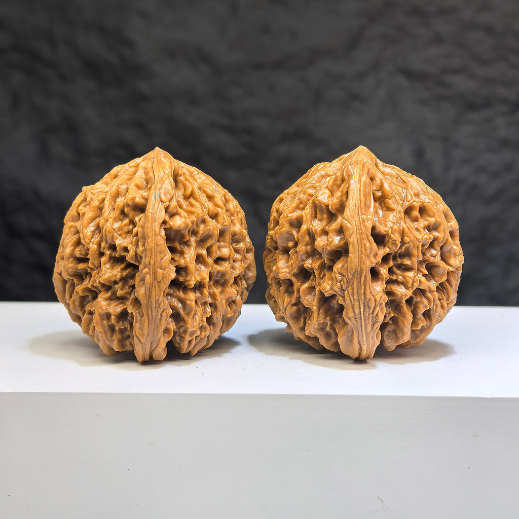 Pair of Nanjiangstone Wenwan walnuts from Wenwan Art, 41mm x 40mm, showcasing smooth, polished, natural stone texture.