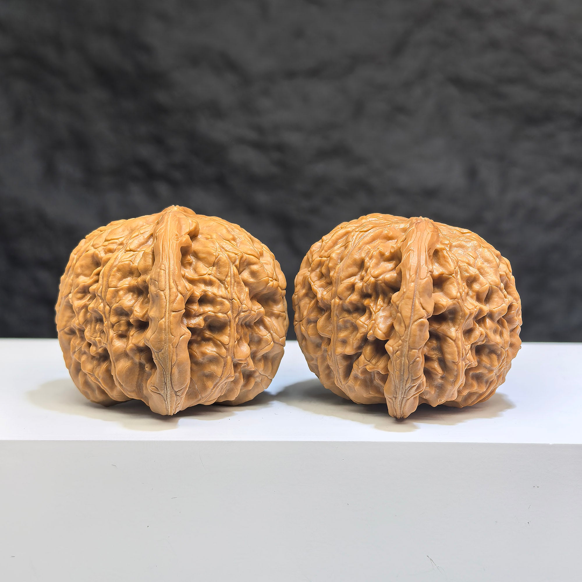 White Lion Wenwan Walnut pair by Wenwan Art, 42mm x 41mm, showcasing detailed carved white lion figures on smooth walnuts.