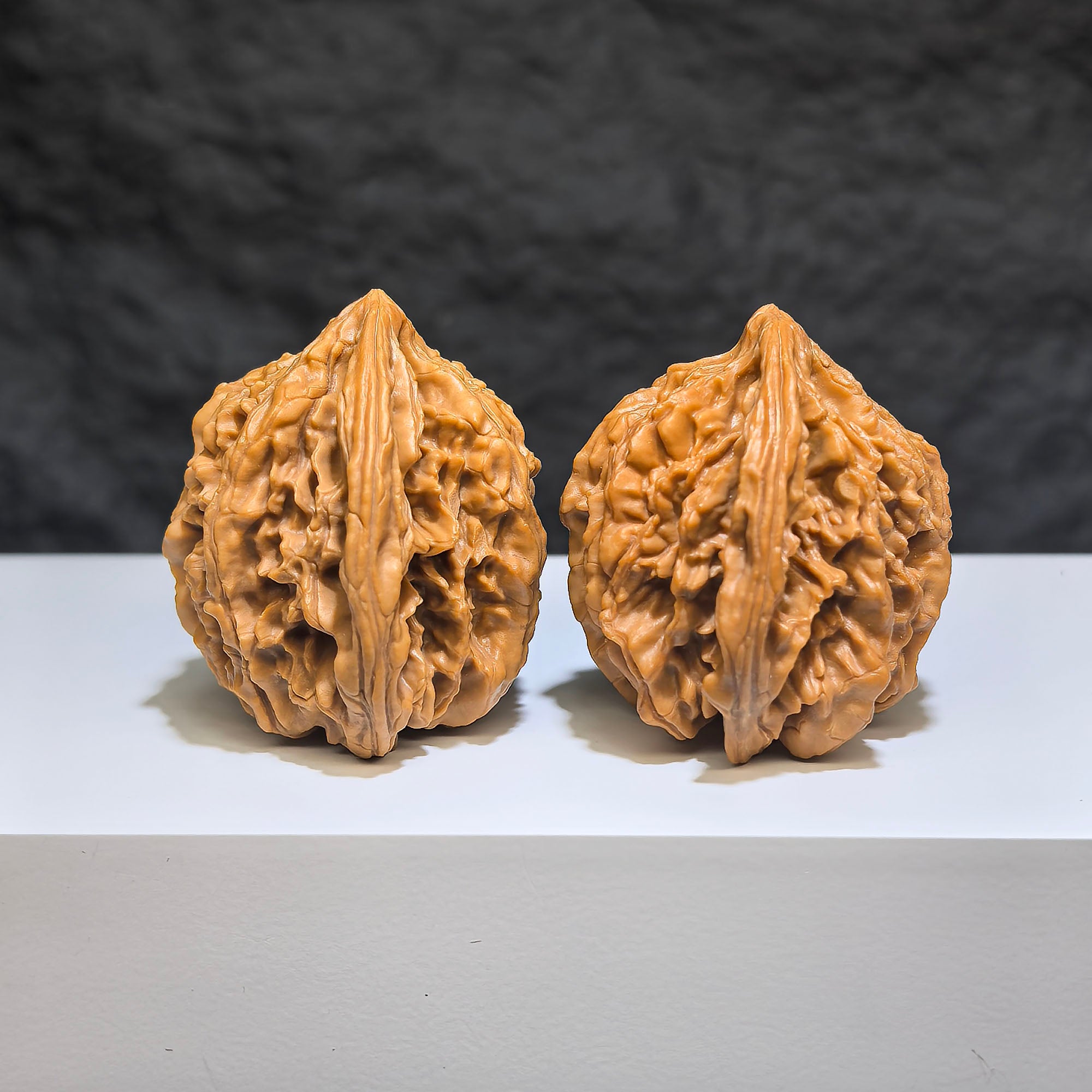 Pair of Tongtian Eight Wenwan walnuts by Wenwan Art, 36mm x 35mm, featuring intricate natural wood grain details.