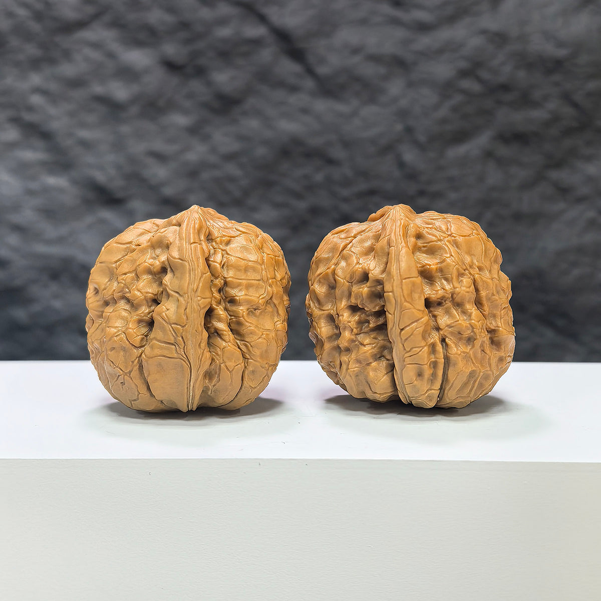 Pair of Classic Scholar Wenwan Walnuts by Wenwan Art, 39mm hand-matched walnuts with intricate carvings on natural walnut surfaces.