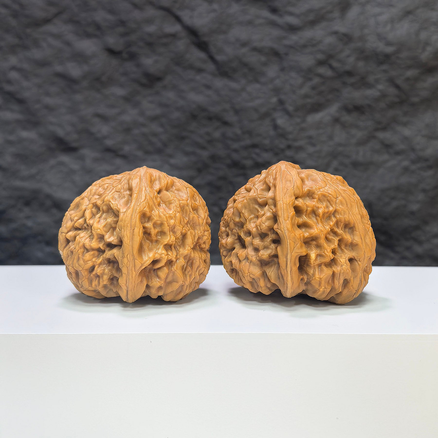 Pair of Wenwan Art Rolling Donkey Wenwan walnuts, 40mm, showcasing detailed craftsmanship and traditional Chinese design.