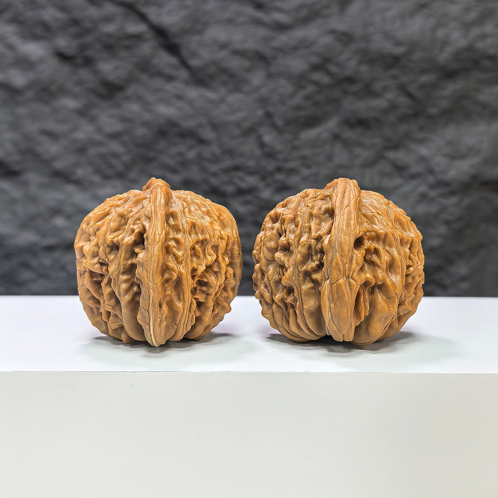 Pair of Sizuolou Classic Wenwan Walnuts from Wenwan Art, 43mm x 39mm, showcasing detailed natural walnut textures.