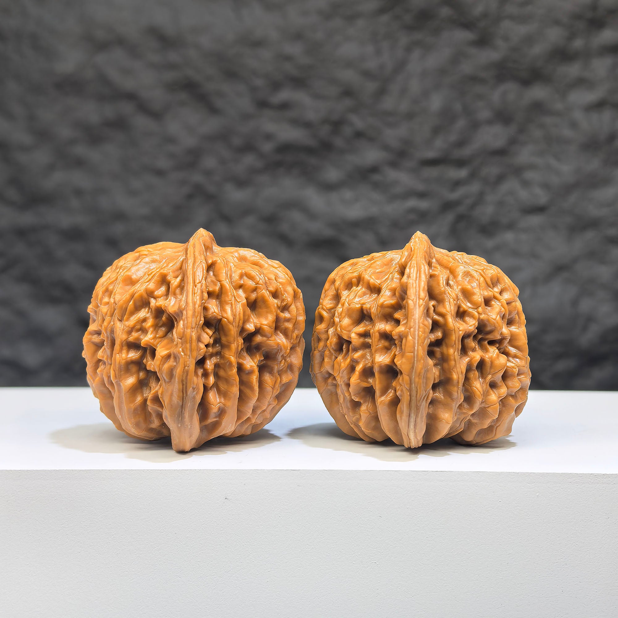 Pair of Sizuolou Wenwan walnuts from Wenwan Art, showcasing detailed carvings and natural wood grain, 40mm size.