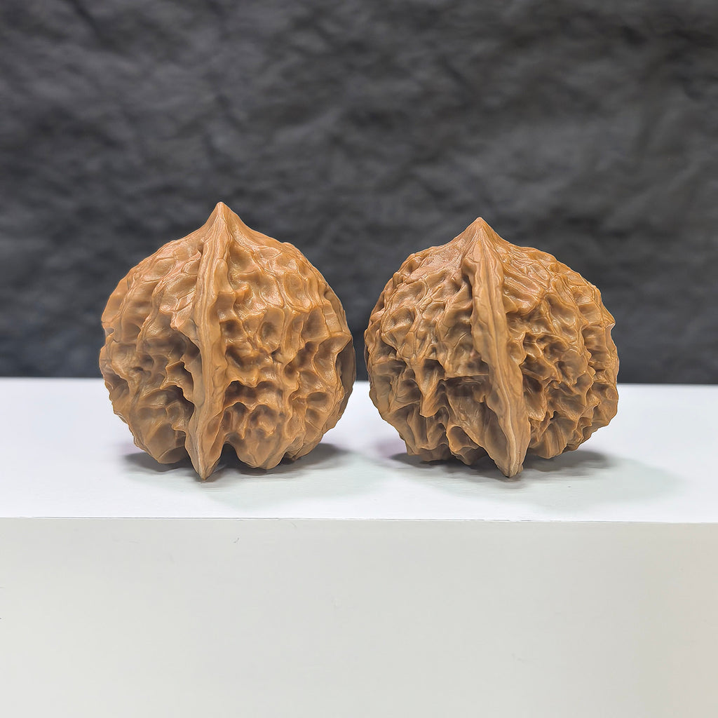 Pair of Pocket White Snake Valley Wenwan walnuts by Wenwan Art, 36mm miniature jade-like carvings with intricate detailing.