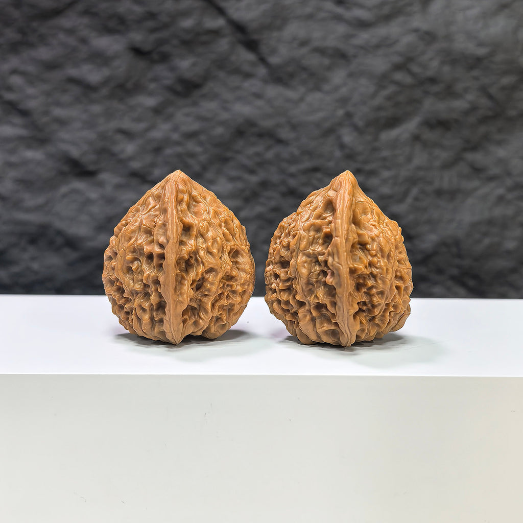 Golden Kylin Wenwan walnut pair by Wenwan Art, 36mm x 34mm, featuring intricate carved designs and rich golden color.