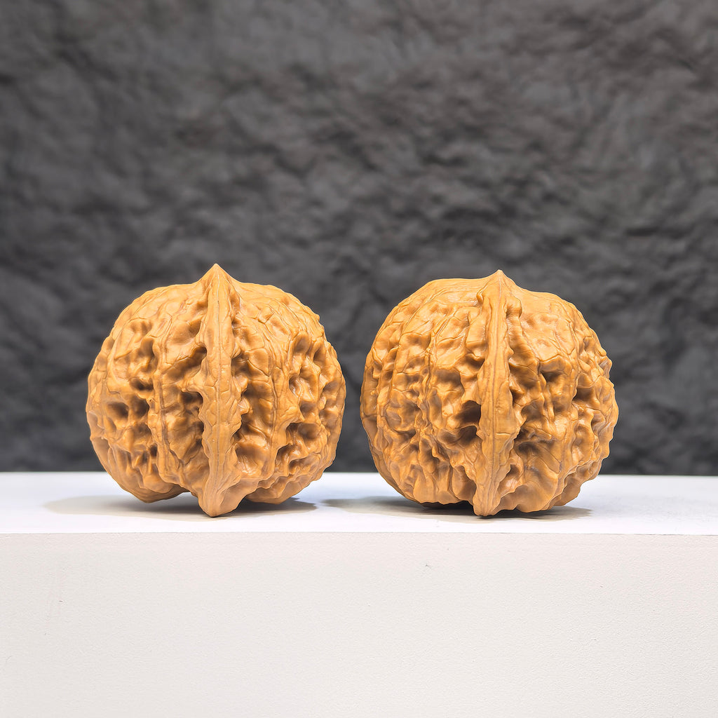 Close-up of a "Wild Wolf" Wenwan Walnut from Wenwan Art, showing its natural wood grain and detailed texture.