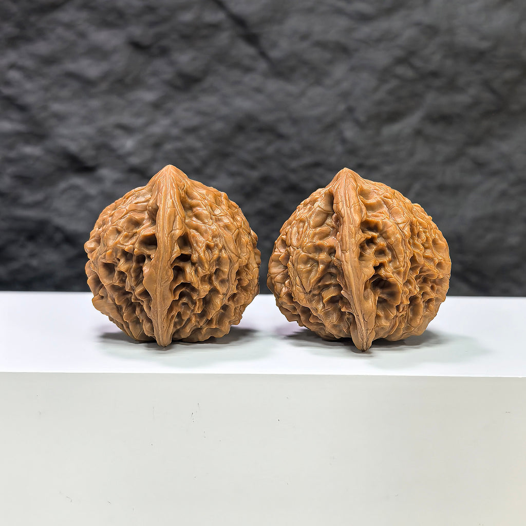 Pair of Golden Kylin Wenwan walnuts by Wenwan Art, featuring 42mm and 40mm intricately carved classic walnut sculptures.