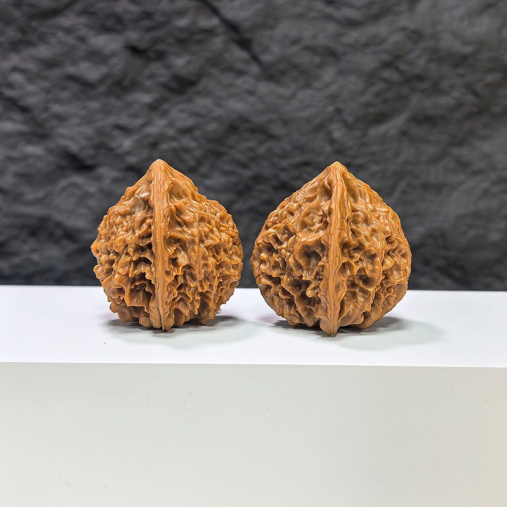 Pair of Golden Kylin Wenwan walnuts from Wenwan Art, 37mm x 38mm, showcasing detailed carvings and golden finish on smooth walnut surfaces.