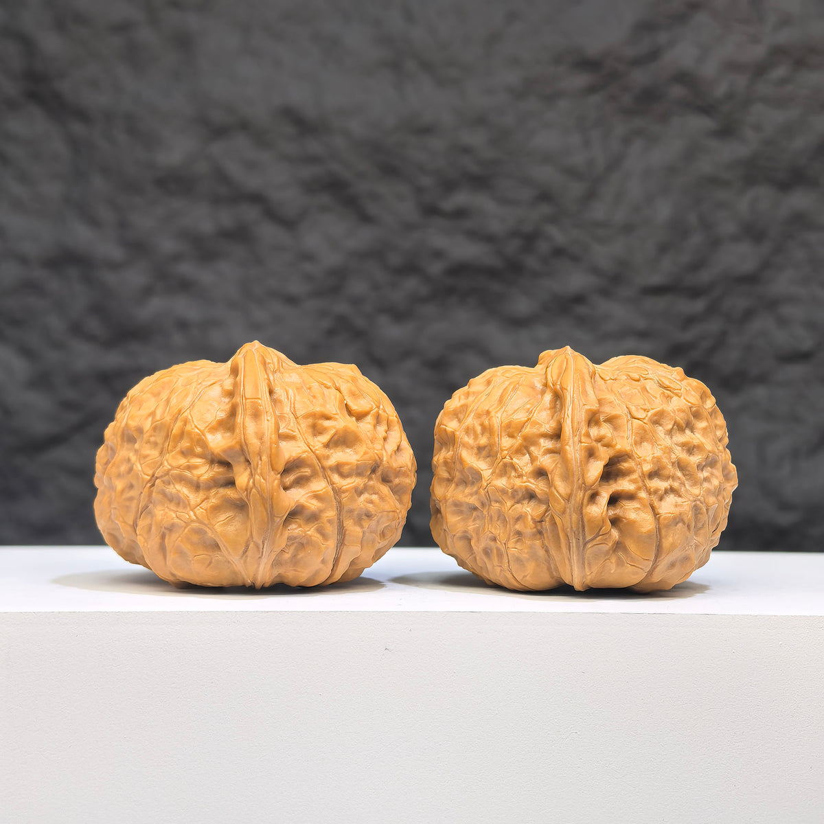 Pair of Wenwan Art Hundred Beasts Lion Head Wenwan walnuts, 43mm x 40mm, featuring detailed carved lion head designs.